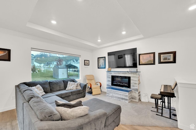 1131 S Red Cliff Dr, Santaquin, UT 84655 - living room featuring recessed lighting, baseboards, a raised ceiling, and a tile fireplace