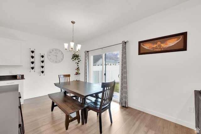 1131 S Red Cliff Dr, Santaquin, UT 84655 - dining space with an inviting chandelier, baseboards, and light wood-style flooring
