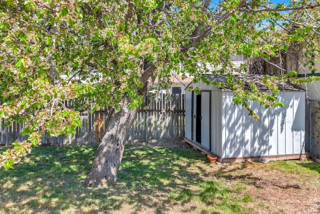 3502 W 8350 S, West Jordan, UT 84088 - view of yard featuring an outdoor structure, a shed, and a fenced backyard
