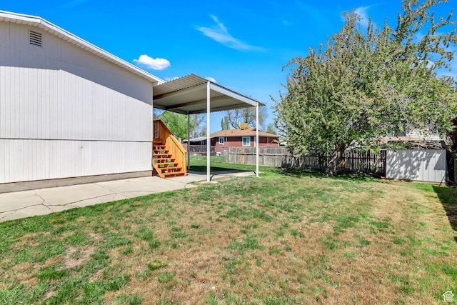 3502 W 8350 S, West Jordan, UT 84088 - view of yard featuring an outdoor structure, stairs, a storage unit, a patio area, and fence