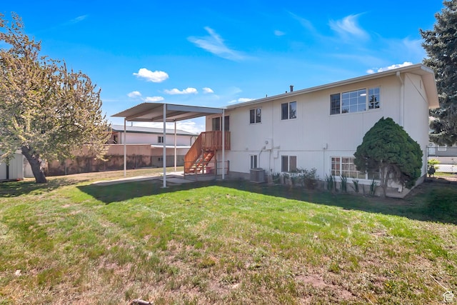 3502 W 8350 S, West Jordan, UT 84088 - rear view of house with fence, central AC unit, and a yard