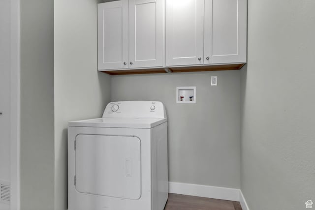 3502 W 8350 S, West Jordan, UT 84088 - washroom featuring baseboards, washer / clothes dryer, cabinet space, and wood finished floors
