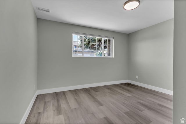 3502 W 8350 S, West Jordan, UT 84088 - spare room with wood finished floors, visible vents, and baseboards