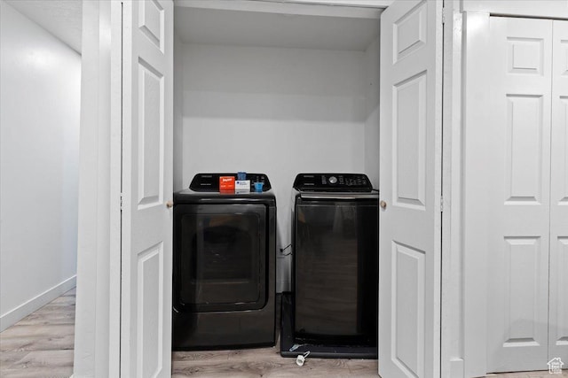 3902 W 4955 S, Taylorsville, UT 84129 - washroom with baseboards, light wood-type flooring, washer and dryer, and laundry area