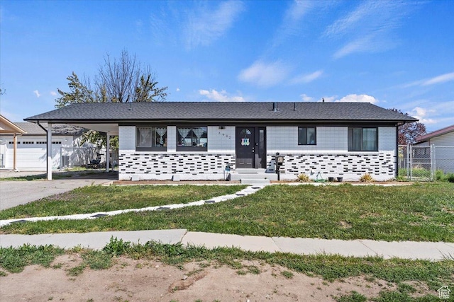3902 W 4955 S, Taylorsville, UT 84129 - view of front of house with driveway, a carport, fence, a front lawn, and brick siding