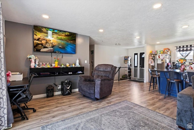 3902 W 4955 S, Taylorsville, UT 84129 - living room featuring recessed lighting, a textured ceiling, and wood finished floors