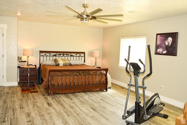 5859 E Ashley Creek Rd S, Vernal, UT 84078 - bedroom with light wood-type flooring, a textured ceiling, baseboards, and ceiling fan