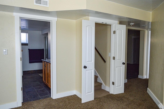 5859 E Ashley Creek Rd S, Vernal, UT 84078 - hall with dark colored carpet and baseboards