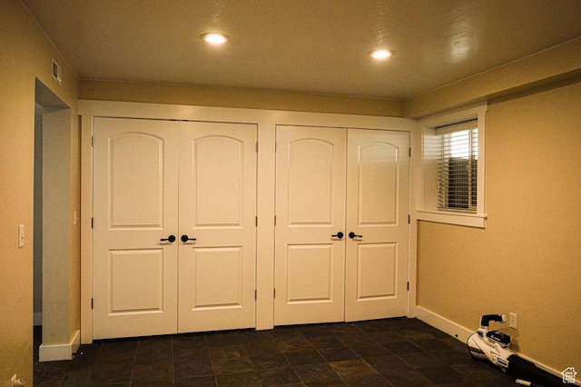 5859 E Ashley Creek Rd S, Vernal, UT 84078 - unfurnished bedroom with multiple closets, baseboards, and recessed lighting