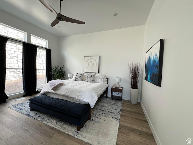 889 S Winter Ln, North Salt Lake, UT 84054 - bedroom with baseboards, ceiling fan, and wood finished floors
