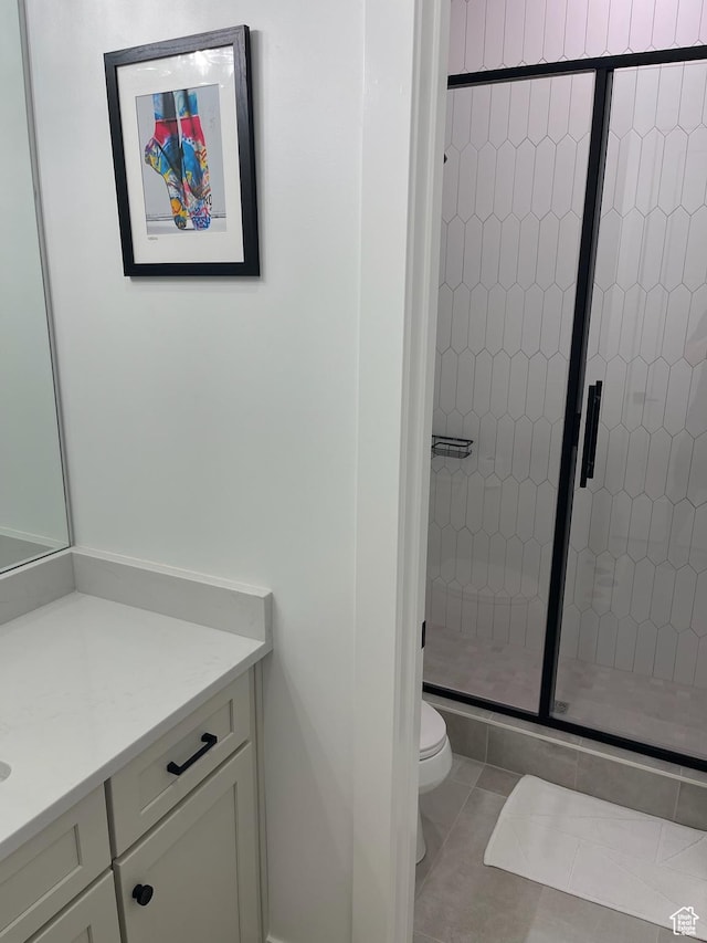 889 S Winter Ln, North Salt Lake, UT 84054 - full bath with vanity, tile patterned floors, toilet, and a shower stall