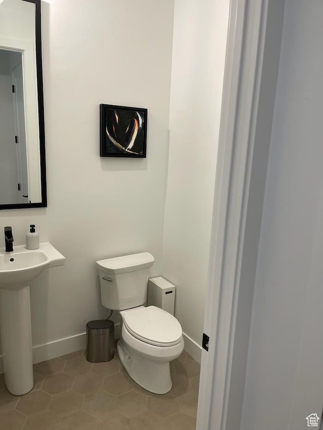 889 S Winter Ln, North Salt Lake, UT 84054 - half bath with baseboards, tile patterned floors, and toilet