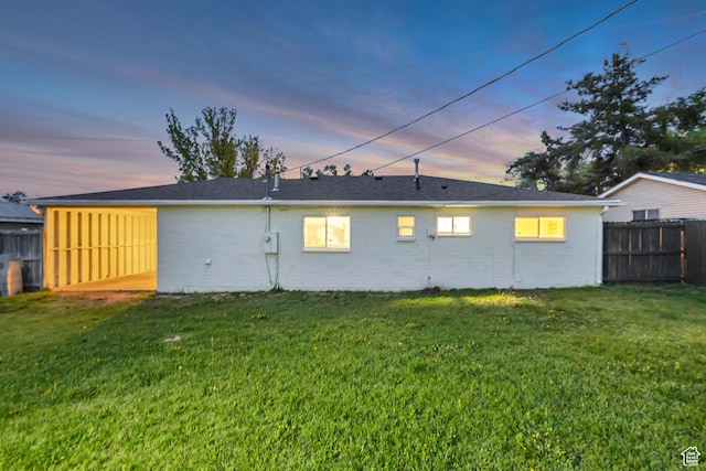 4826 S 4860 W, Salt Lake City, UT 84118 - rear view of property with a lawn, fence, and brick siding