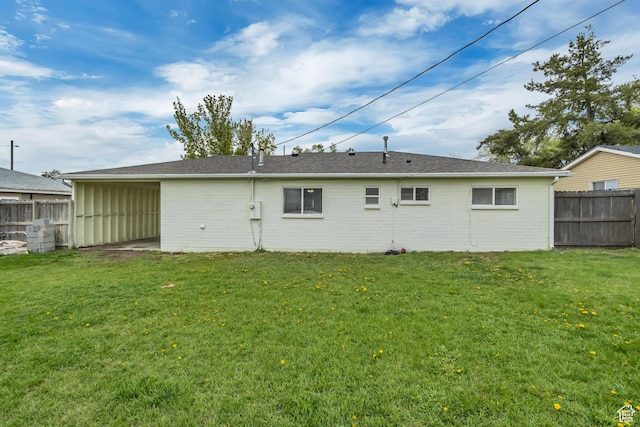 4826 S 4860 W, Salt Lake City, UT 84118 - rear view of house featuring fence, a yard, and brick siding