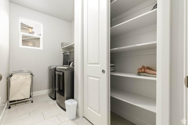 1427 N Rustico Dr, Washington, UT 84780 - clothes washing area featuring independent washer and dryer, baseboards, and tile patterned flooring