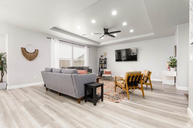1427 N Rustico Dr, Washington, UT 84780 - living room with a raised ceiling, recessed lighting, ceiling fan, light wood-style floors, and baseboards