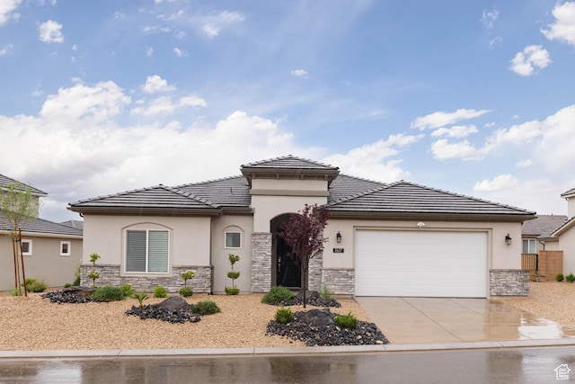 1427 N Rustico Dr, Washington, UT 84780 - view of front of home with stone siding, stucco siding, and an attached garage
