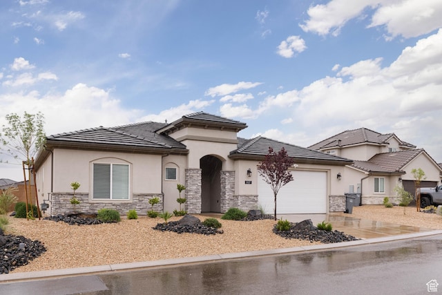 1427 N Rustico Dr, Washington, UT 84780 - view of front of home featuring stone siding, stucco siding, an attached garage, and a tile roof