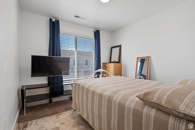 carpeted bedroom with visible vents