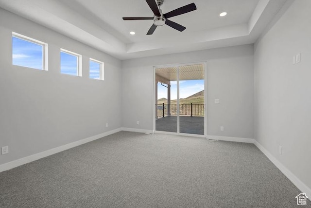 2275 E Meadowlark Ln N, North Logan, UT 84341 - spare room featuring baseboards, a raised ceiling, a ceiling fan, and carpet flooring