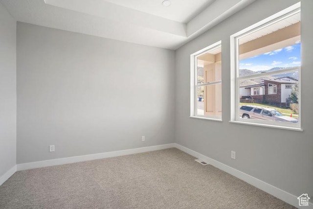 2275 E Meadowlark Ln N, North Logan, UT 84341 - carpeted empty room featuring baseboards, visible vents, and a raised ceiling