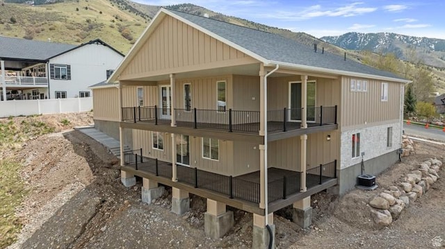 2275 E Meadowlark Ln N, North Logan, UT 84341 - rear view of property with a mountain view, roof with shingles, and a balcony