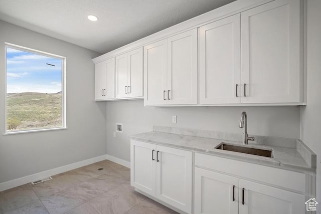 2275 E Meadowlark Ln N, North Logan, UT 84341 - laundry room featuring hookup for a washing machine, recessed lighting, cabinet space, a sink, and baseboards