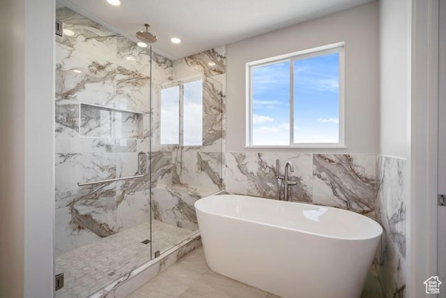 2275 E Meadowlark Ln N, North Logan, UT 84341 - bathroom with recessed lighting, marble finish floor, tile walls, a soaking tub, and a marble finish shower