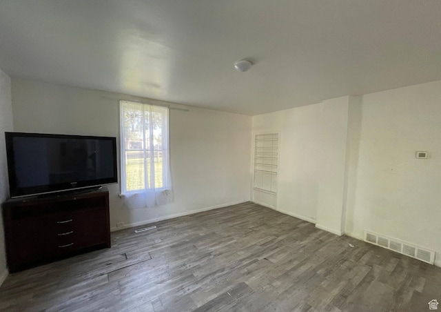 280 N Main St, Smithfield, UT 84335 - unfurnished living room with visible vents, wood finished floors, and baseboards