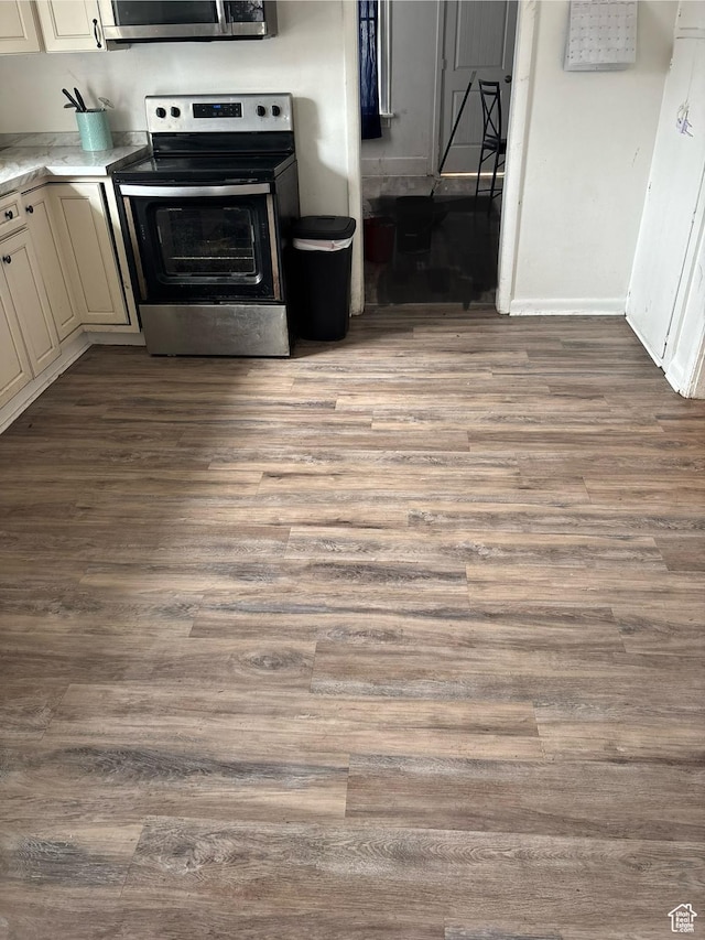 280 N Main St, Smithfield, UT 84335 - kitchen featuring appliances with stainless steel finishes, wood finished floors, and light countertops