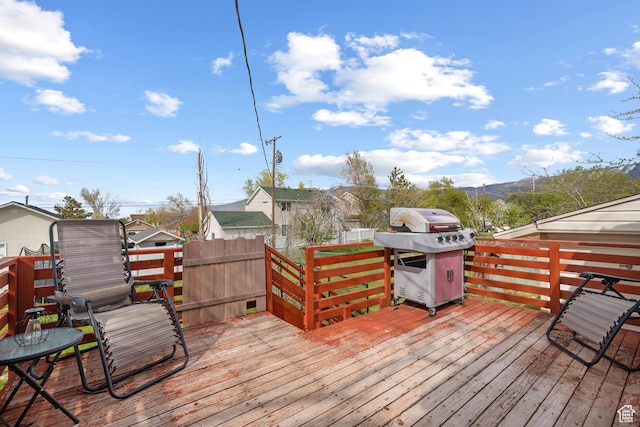 501 Valley View Dr, Tooele, UT 84074 - deck with a mountain view, fence, and grilling area