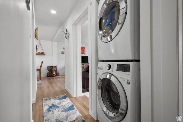 501 Valley View Dr, Tooele, UT 84074 - washroom featuring baseboards, stacked washing maching and dryer, recessed lighting, wood finished floors, and laundry area