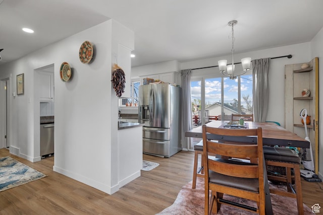 501 Valley View Dr, Tooele, UT 84074 - dining space with light wood finished floors, recessed lighting, a chandelier, visible vents, and baseboards
