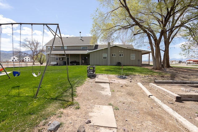 815 S Annabella Rd, Richfield, UT 84701 - rear view of house with a yard, board and batten siding, and a playground