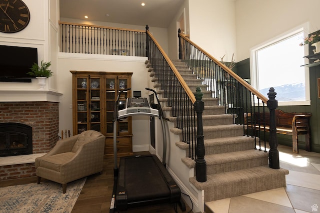 815 S Annabella Rd, Richfield, UT 84701 - stairs with a fireplace, recessed lighting, and a high ceiling