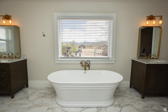 815 S Annabella Rd, Richfield, UT 84701 - bathroom featuring baseboards, a freestanding bath, a sink, and marble finish floor