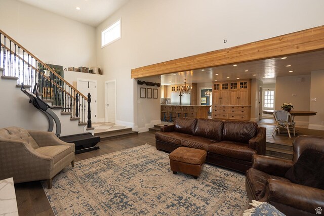 815 S Annabella Rd, Richfield, UT 84701 - living room with recessed lighting, stairway, baseboards, a towering ceiling, and wood finished floors