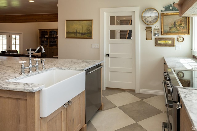 815 S Annabella Rd, Richfield, UT 84701 - kitchen featuring a sink, light stone counters, stainless steel appliances, and baseboards