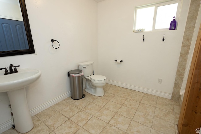 815 S Annabella Rd, Richfield, UT 84701 - bathroom with toilet, tile patterned flooring, a sink, and baseboards