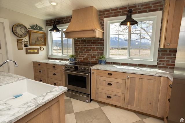 815 S Annabella Rd, Richfield, UT 84701 - kitchen with a sink, electric stove, custom range hood, and a wealth of natural light