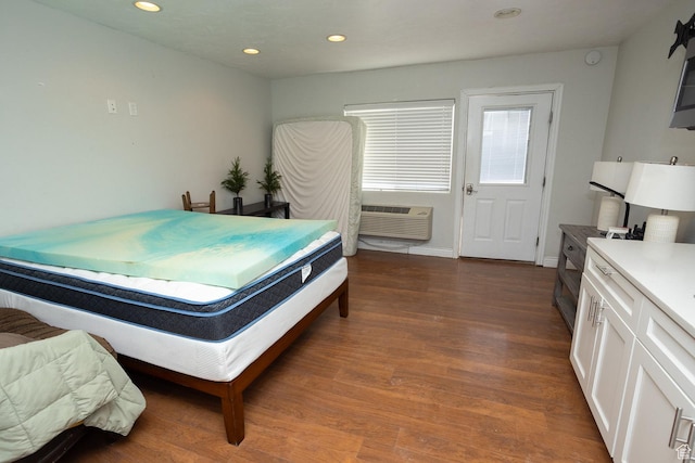 815 S Annabella Rd, Richfield, UT 84701 - bedroom featuring dark wood-style flooring, a wall mounted air conditioner, and recessed lighting