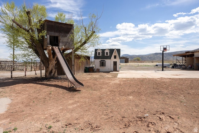 815 S Annabella Rd, Richfield, UT 84701 - view of yard with fence, an outdoor structure, and a mountain view