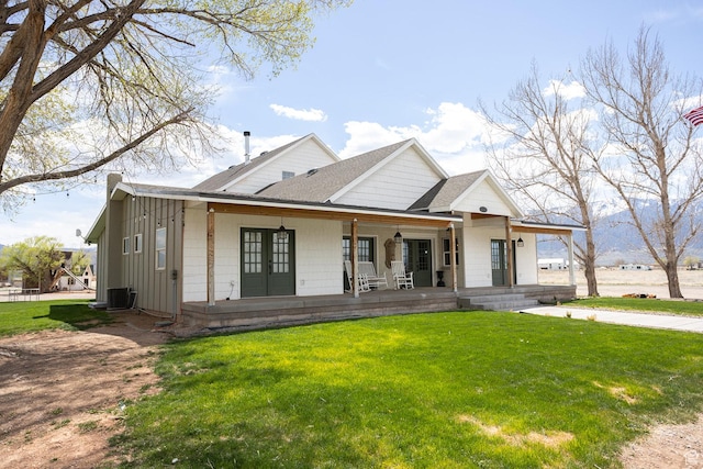 815 S Annabella Rd, Richfield, UT 84701 - modern farmhouse style home with roof with shingles, board and batten siding, a porch, and a front lawn