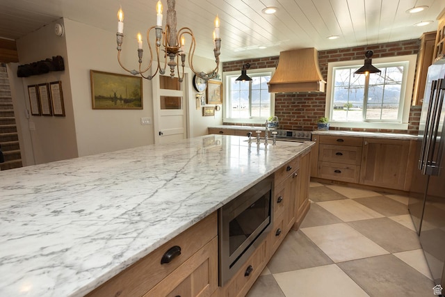815 S Annabella Rd, Richfield, UT 84701 - kitchen featuring recessed lighting, light stone countertops, a sink, custom range hood, and appliances with stainless steel finishes