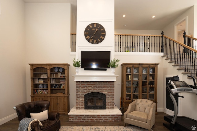 815 S Annabella Rd, Richfield, UT 84701 - living area featuring baseboards, recessed lighting, wood finished floors, and a brick fireplace