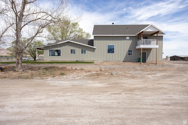 815 S Annabella Rd, Richfield, UT 84701 - rear view of house with roof with shingles, board and batten siding, and a balcony