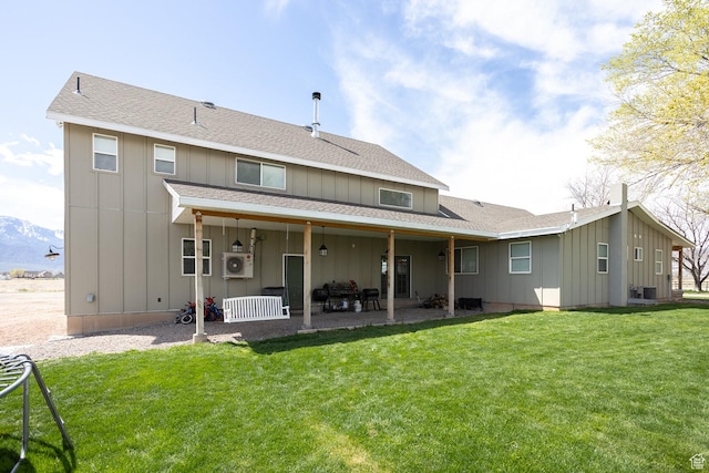 815 S Annabella Rd, Richfield, UT 84701 - rear view of house with a lawn, a shingled roof, board and batten siding, and a patio area