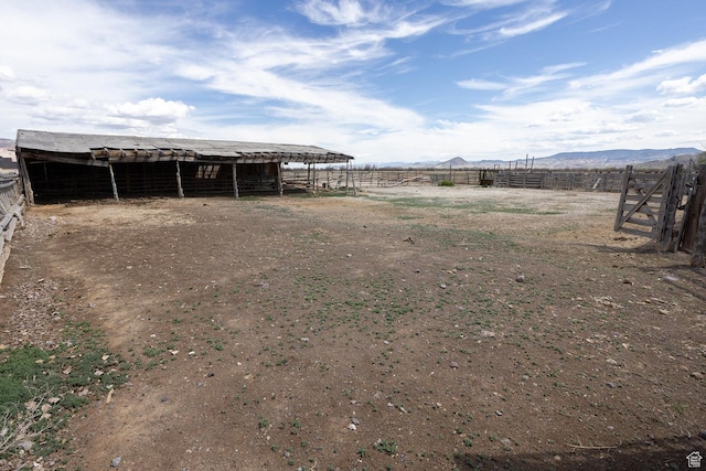 815 S Annabella Rd, Richfield, UT 84701 - view of yard featuring an outdoor structure, a mountain view, and an exterior structure