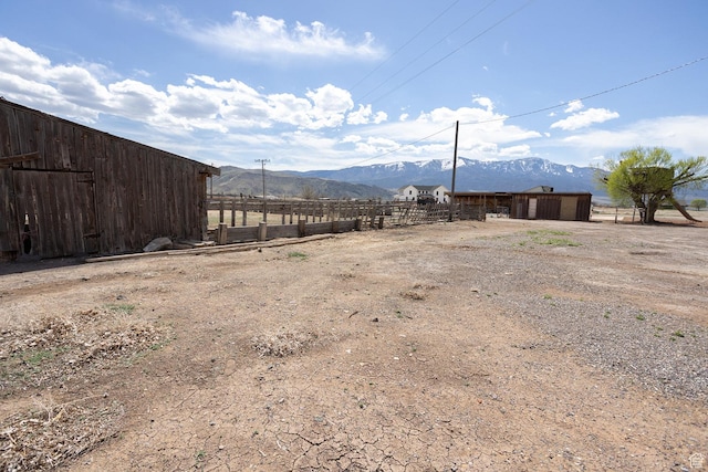 815 S Annabella Rd, Richfield, UT 84701 - view of yard featuring fence, an outdoor structure, and a mountain view