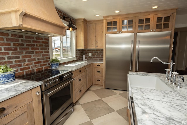 815 S Annabella Rd, Richfield, UT 84701 - kitchen featuring recessed lighting, light floors, glass insert cabinets, premium appliances, and premium range hood